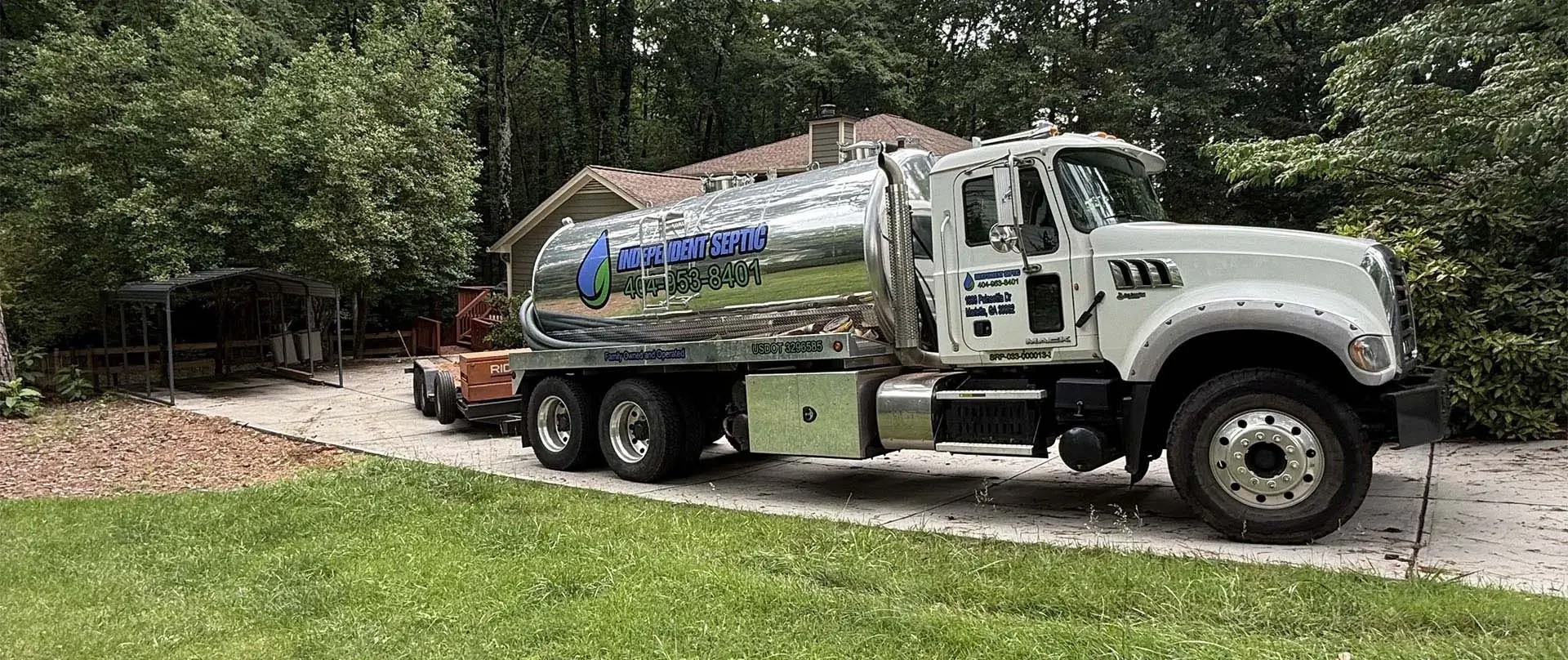 Independent Septic service truck at a home